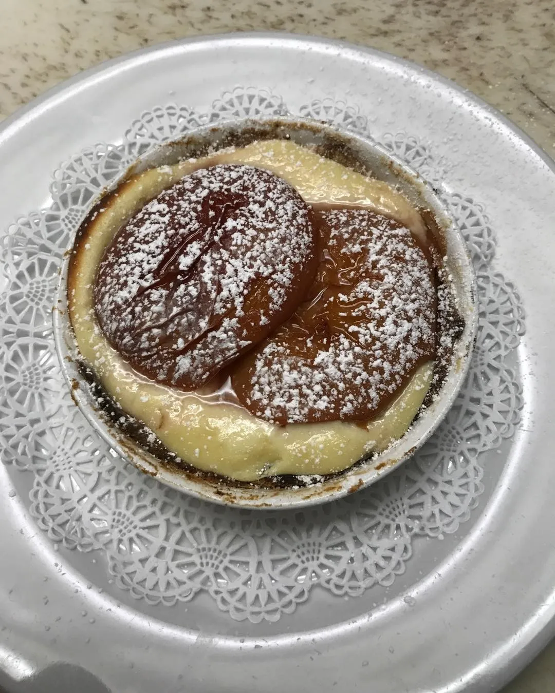 Pear tart with powdered sugar at Onotria